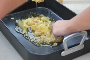 Little fingers (Boo I believe) picking honey comb to eat